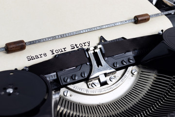Fototapete - Heading Share Your Story written with typewriter on yellowish paper