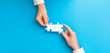 © REDPIXEL - People holds in hand a jigsaw puzzle. Business solutions, success and strategy.