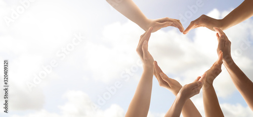 Fotomural The concept of unity, cooperation, teamwork and charity.