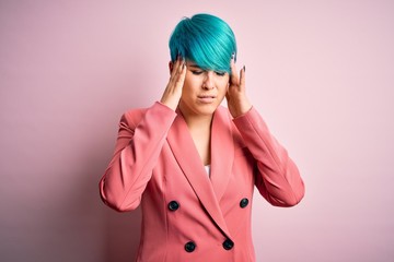 Sticker - Young beautiful businesswoman with blue fashion hair wearing jacket over pink background with hand on head for pain in head because stress. Suffering migraine.