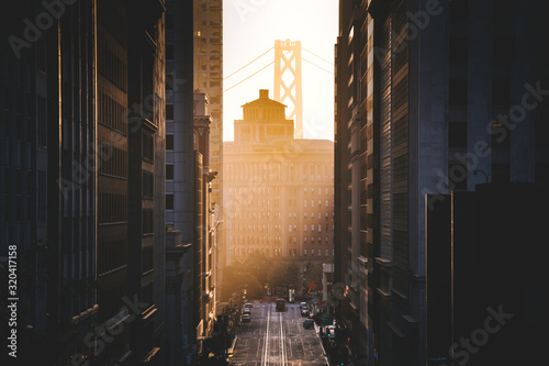 Downtown San Francisco with famous California Street illuminated in first golden Wallpaper Mural