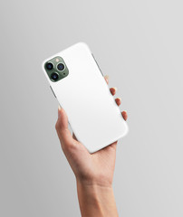 Hand holding phone with white black case on isolated background 