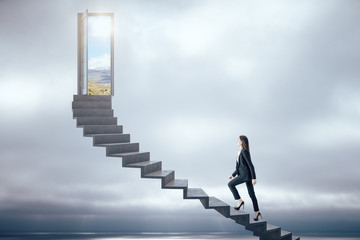 Canvas Print - Businesswoman walking on ladder to success