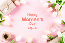 International Women's Day Concept. Pink And White Tulips With Gift Box And Paper Tag Text On Pink Pastel Background. Top View Flat Lay, March 8.