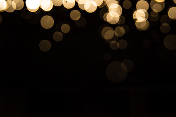 Abstract gold bokeh with black background