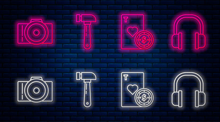 Poster - Set line Hammer, Casino chip and playing cards, Photo camera and Headphones. Glowing neon icon on brick wall. Vector