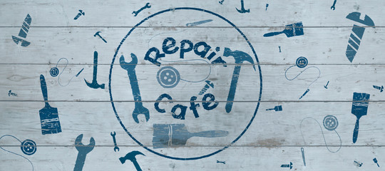 Wall Mural - Repair Cafe logo on wooden board,  surrounded by repair tools, header or background, consumer movement to repair household items to reduce waste and support a sustainable lifestyle