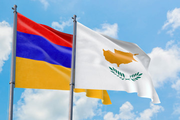 Wall Mural - Cyprus and Armenia flags waving in the wind against white cloudy blue sky together. Diplomacy concept, international relations.