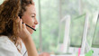 © Mongkolchon - business background of caucasian female call center agent on service with call from customer at customers relation and helpdesk center