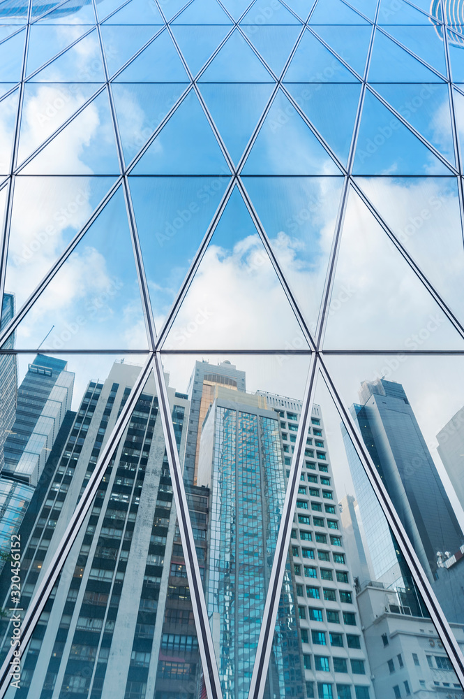 Reflection of urban skyline on modern office building Stock Photo ...