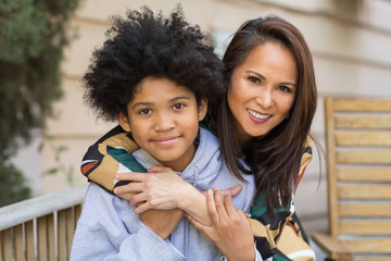 Portrait of an Asian mother with her teenage son.