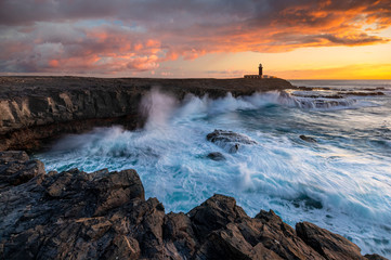 Wall Mural - beautiful sunset on the cliffs of faro de jandia in fuerteventura