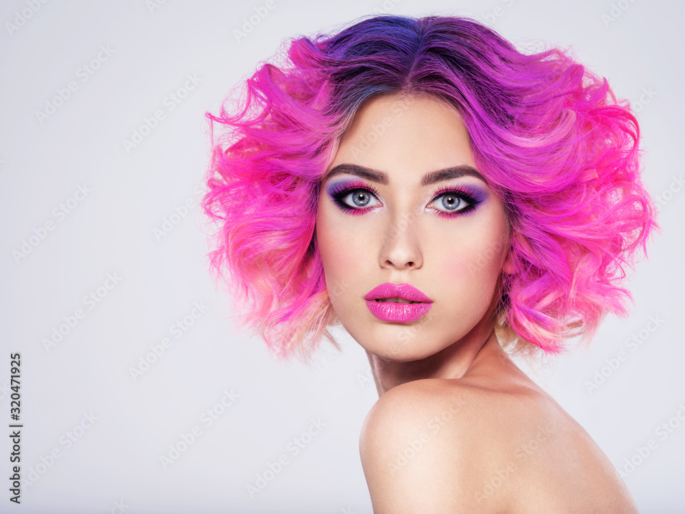 Portrait of beautiful young woman with bright pink makeup. Beautiful blonde with bright pink lipstick on her lips. Pretty girl with vivid hair. Blonde with brightly colored hair. Bright eye makeup. - obrazy, fototapety, plakaty 