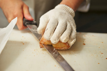 Sticker - Slicing bread half with knife