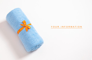 Rolled blue terry towel tie up by orange ribbon against a white background with empty space for your information