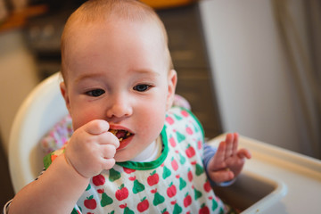 6 months old self feeding.