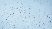 Close Up Of Water Droplets On Glass. Window With Rain Drops. 