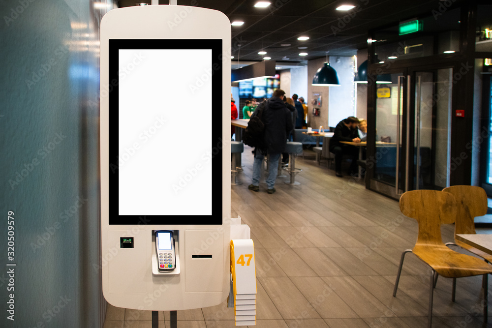 Self-service desk with touch screen in fast food restaurant - obrazy, fototapety, plakaty 