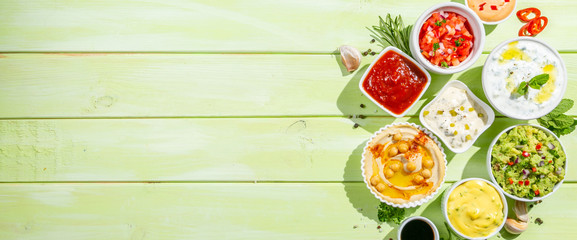 Wall Mural - Selection of sauces in white bowls on white bowls, top view