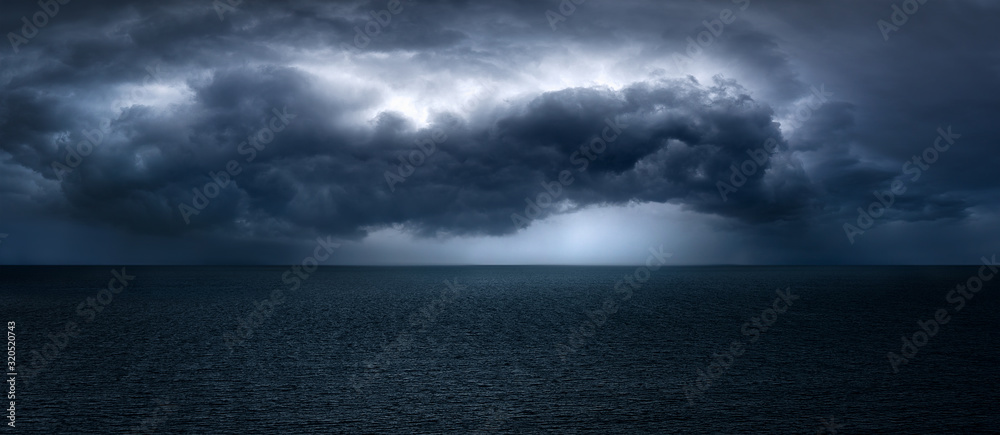 dark and dramatic stormy clouds over sea - obrazy, fototapety, plakaty 