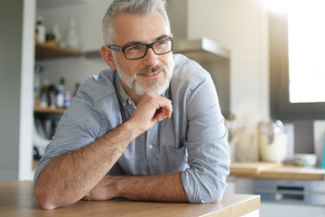 Wall Mural - Portrait of smiling mature man with glasses