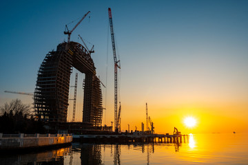 Wall Mural - Caspian Sea coast in Baku during sunrise, new construction