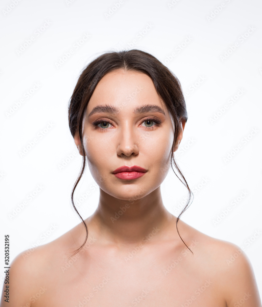 Beautiful young woman with bare shoulders on a white background Stock ...