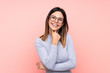 © luismolinero - Woman over isolated pink background with glasses and smiling