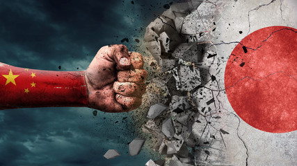 Wall Mural - Fist breaking rock. China destroying Japan