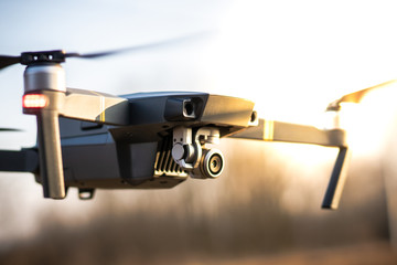 Wall Mural - flying drone with sunset view