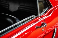 Open Window And Door Handle Of Red Classic Car