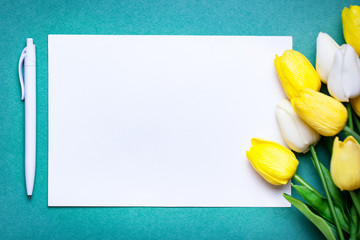 Wall Mural - bouquet of spring tulips on a bright background. greeting card. space for text.