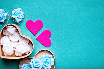 Wall Mural - greeting card with flowers and heart. background with copy space. selective focus. top view.