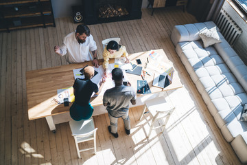 Sticker - Concentrating multiethnic coworkers working in modern light office