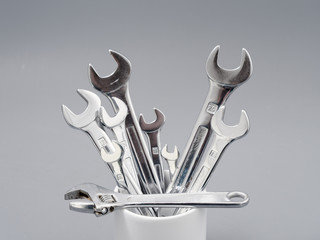 auto repair wrenches on a gray background