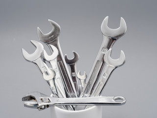 auto repair wrenches on a gray background