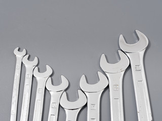 auto repair wrenches on a gray background