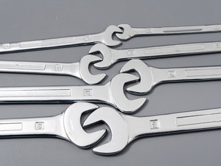 auto repair wrenches on a gray background