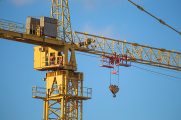 Construction crane at the construction site of an apartment house