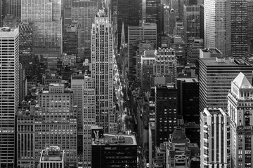 Fototapete - Aerial view of New York City skyline with 5th Avenue at Manhattan midtown. Urban skyscrapers at dramatic after the storm sunset, USA. Black and white image.