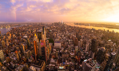 Fototapete - New York City skyline with Manhattan skyscrapers at dramatic vibrant after the storm sunset, USA. Rainbow can be seen in background over Brooklyn bridge.