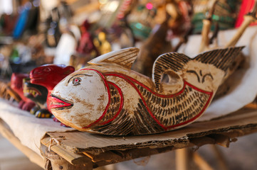 Wall Mural - Wooden figurines souvenirs in the market of Myanmar