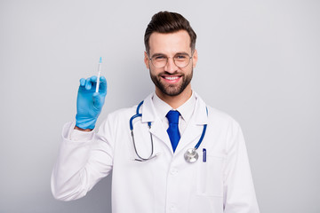 Poster - Close-up portrait of his he nice attractive cheerful cheery experienced confident qualified bearded doc paramedic preparing prick vaccine isolated on light white gray pastel color background