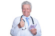 © aletia2011 - Senior male doctor holding money and showing ok
