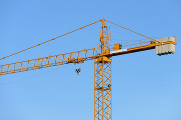 Wall Mural - construction tower crane against the blue sky