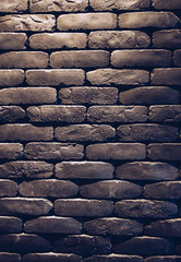 Wall Mural - Close up Grey brick wall with light for concept design background wallpaper