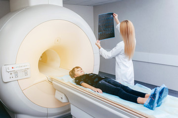 Young female doctor checking a mri picture