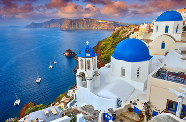 Fira town on Santorini island, Greece. Incredibly romantic sunrise on Santorini. Oia village in the morning light. Amazing sunset view with white houses. Island of lovers