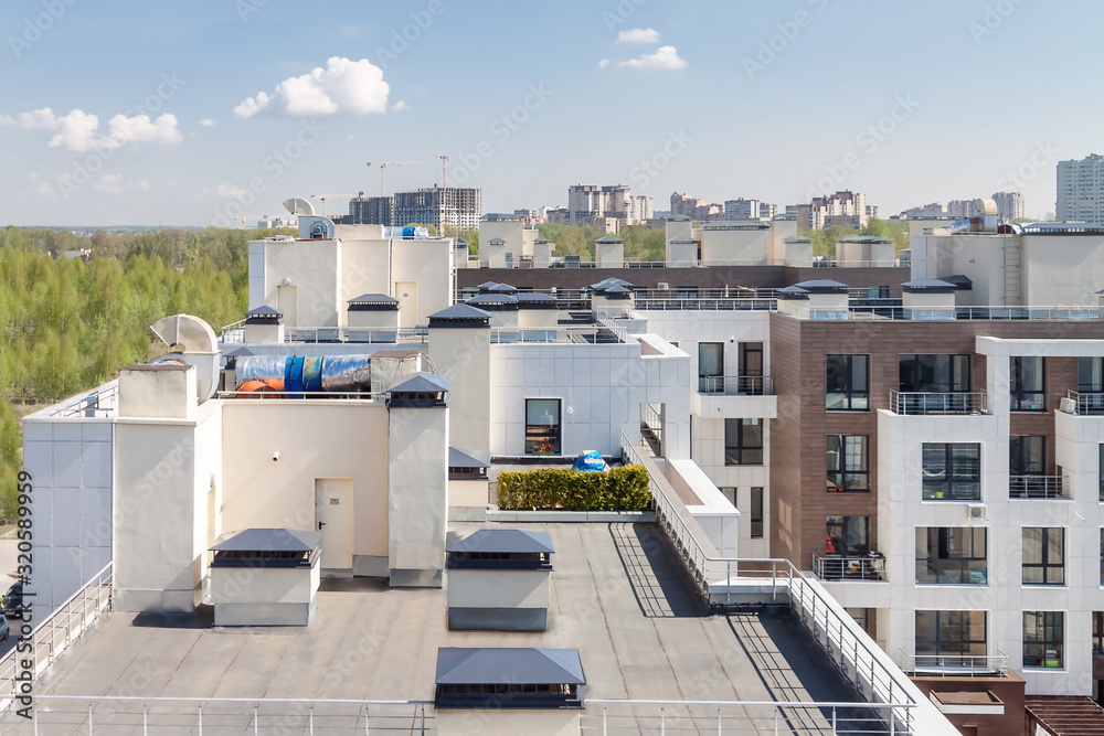 Flat roof with air conditioners on top modern apartment house building ...