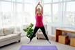 © mirage_studio - Young fitness woman doing jumping jacks or star jump exercise at home, copy space. Girl working out, full length portrait. Healthy lifestyle concept